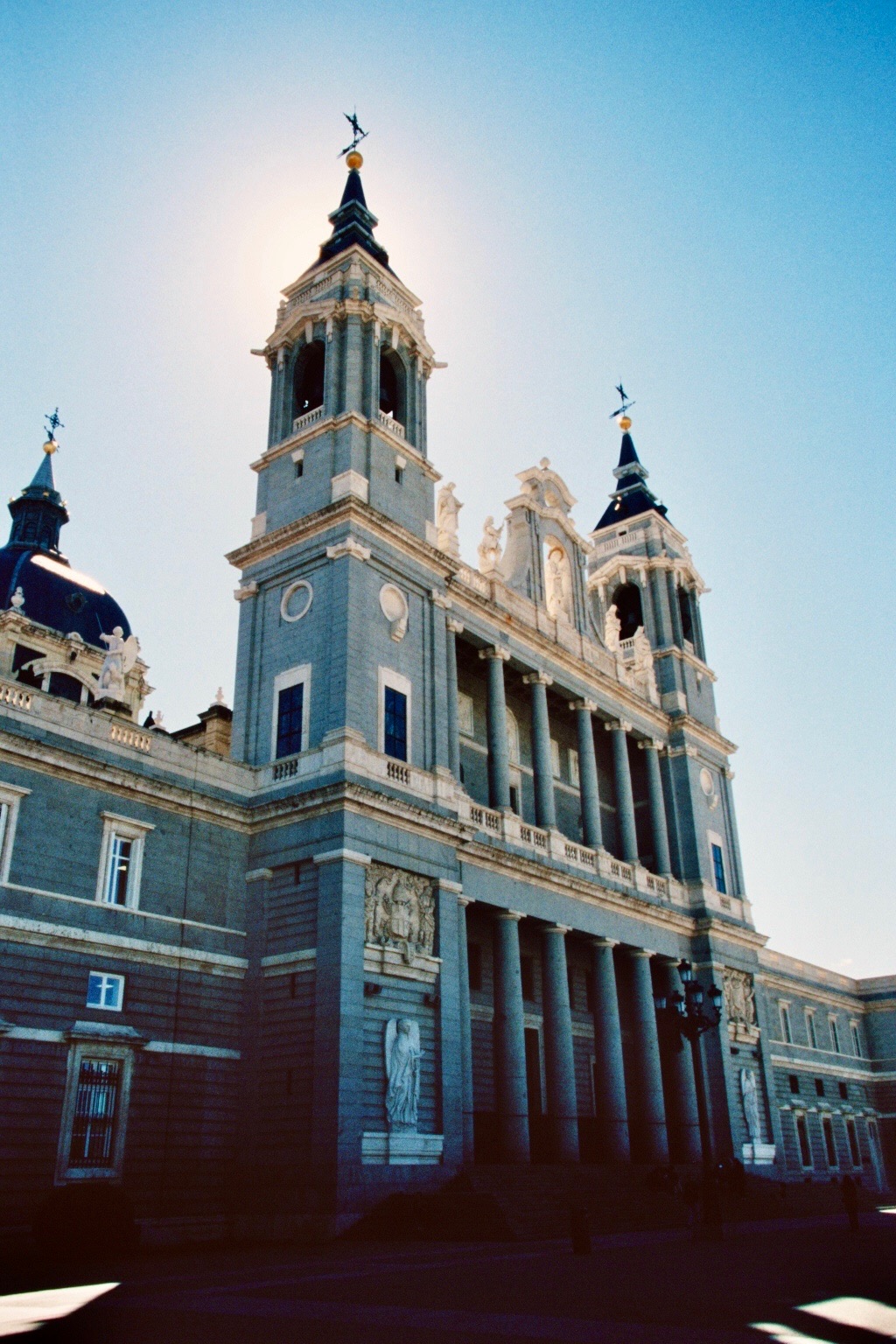 Film photograph of a cathedral facade against a pale blue sky
